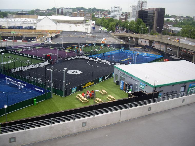 Several five-a-side pitches seen from above, with floodlights